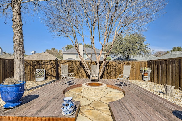 4212 Honeysuckle Dr, Mckinney, TX 75070 - wooden deck with a fire pit and a fenced backyard