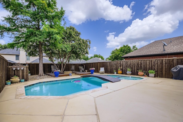4212 Honeysuckle Dr, Mckinney, TX 75070 - view of swimming pool with an in-ground hot tub, a fenced backyard, a patio, and area for grilling