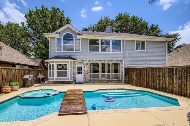 4212 Honeysuckle Dr, Mckinney, TX 75070 - view of swimming pool featuring a patio, a fenced backyard, a pool with connected hot tub, and grilling area