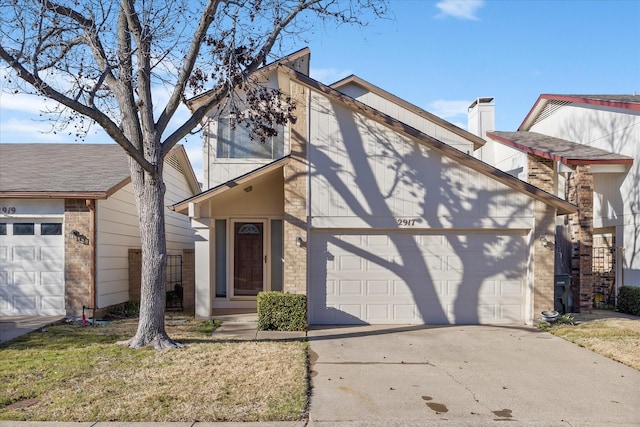 view of front of property featuring driveway and an attached garage