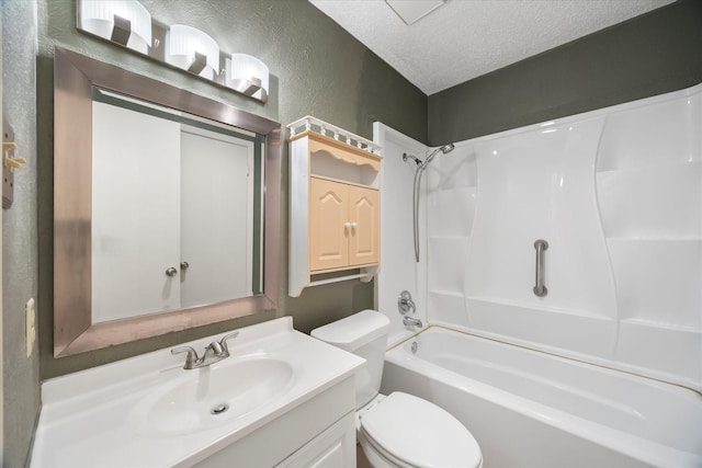 bathroom with shower / bathtub combination, a textured wall, toilet, a textured ceiling, and vanity