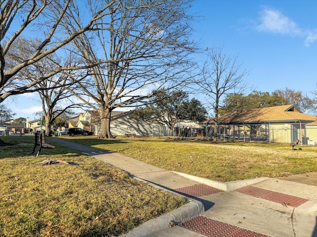 view of yard featuring a residential view and fence