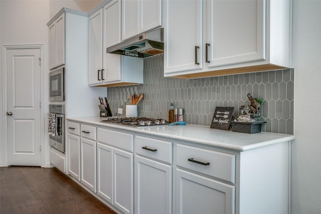 kitchen featuring light countertops, appliances with stainless steel finishes, white cabinets, and under cabinet range hood