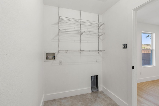 laundry area with washer hookup, laundry area, and baseboards