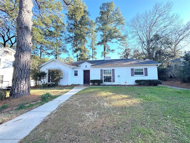 ranch-style house with a front yard