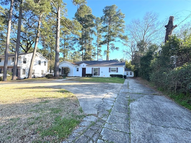 exterior space featuring a front yard and driveway