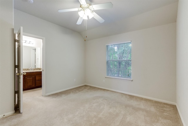 11451 La Grange Dr, Frisco, TX 75035 - unfurnished bedroom with light carpet, baseboards, a sink, lofted ceiling, and ensuite bath