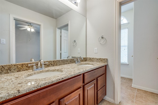 11451 La Grange Dr, Frisco, TX 75035 - bathroom featuring double vanity, baseboards, tile patterned floors, and ceiling fan