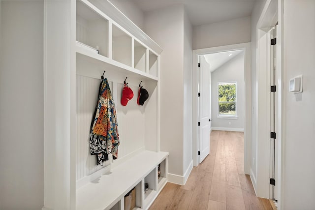 mudroom featuring light wood-type flooring and baseboards