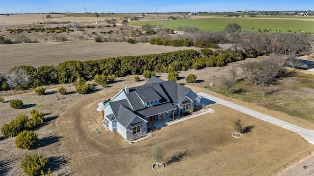 birds eye view of property with a rural view