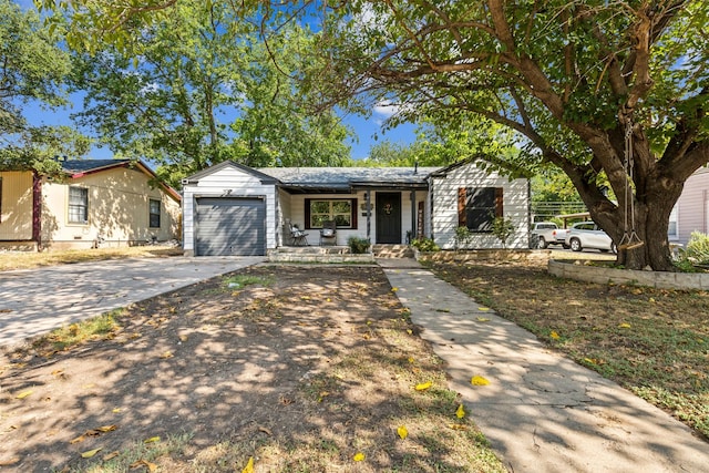 view of front of house featuring an attached garage and concrete driveway