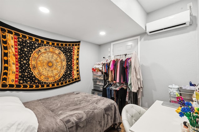 bedroom featuring recessed lighting, a closet, and a wall mounted air conditioner