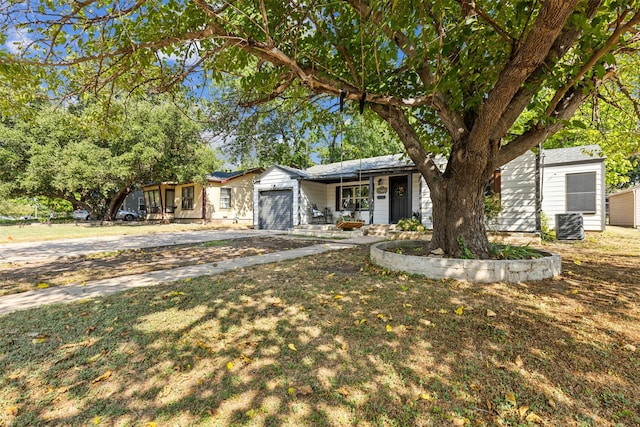 view of front of house with a garage and concrete driveway