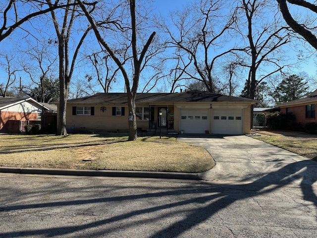 single story home featuring a front lawn, concrete driveway, brick siding, and an attached garage