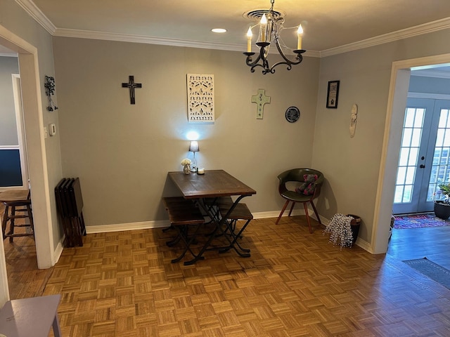 dining area with baseboards and crown molding