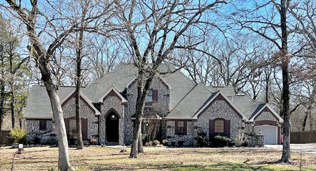 view of front facade featuring stone siding