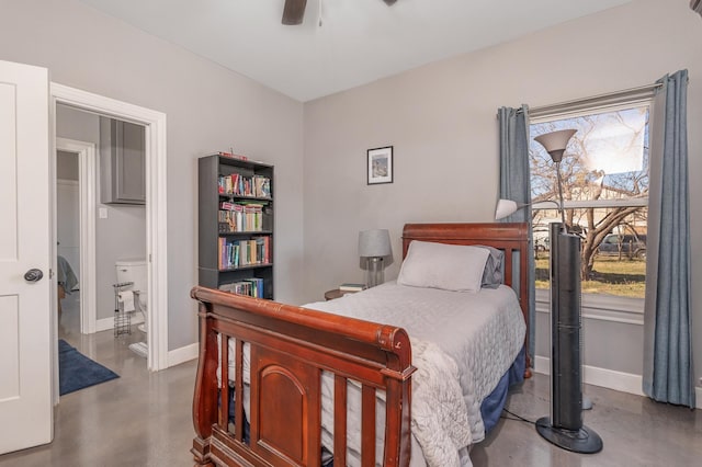 bedroom featuring finished concrete floors, ceiling fan, and baseboards