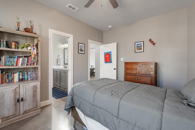 bedroom featuring ceiling fan, concrete floors, a sink, visible vents, and ensuite bath