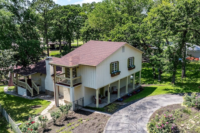 1501 Oak Shore Dr, Tool, TX 75143 - view of front of house with a front lawn, stairs, a shingled roof, and fence