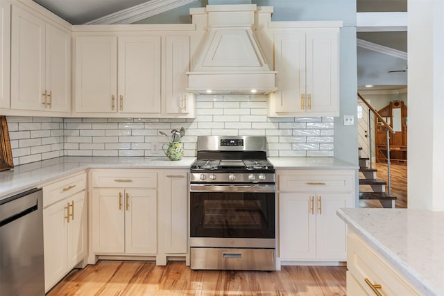 1501 Oak Shore Dr, Tool, TX 75143 - kitchen with custom exhaust hood, decorative backsplash, light wood-style floors, appliances with stainless steel finishes, and crown molding
