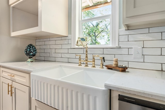 1501 Oak Shore Dr, Tool, TX 75143 - room details featuring white cabinets, a sink, light stone countertops, dishwasher, and backsplash