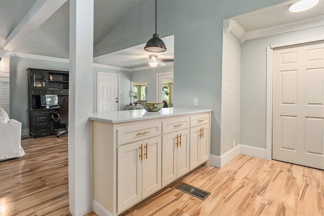 1501 Oak Shore Dr, Tool, TX 75143 - kitchen with crown molding, light wood finished floors, a ceiling fan, and visible vents