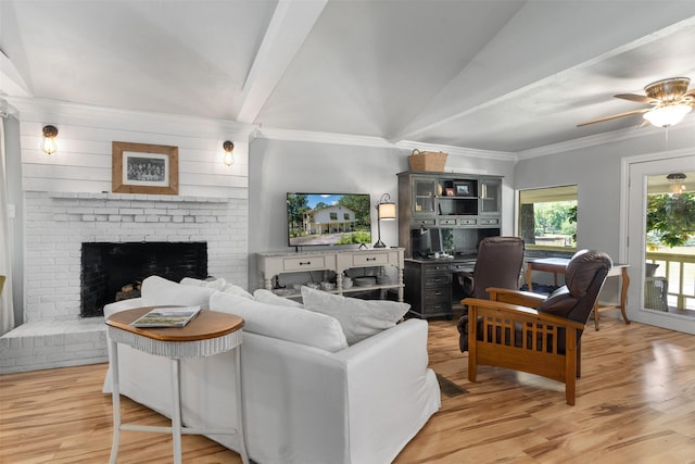 1501 Oak Shore Dr, Tool, TX 75143 - living area with lofted ceiling with beams, a brick fireplace, light wood-type flooring, crown molding, and a ceiling fan