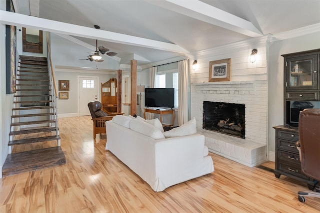 1501 Oak Shore Dr, Tool, TX 75143 - living area featuring vaulted ceiling with beams, light wood finished floors, stairway, a ceiling fan, and crown molding