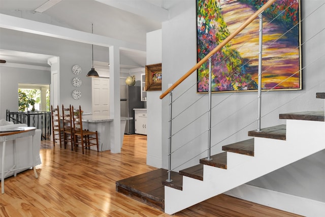 1501 Oak Shore Dr, Tool, TX 75143 - stairs featuring wood finished floors, ornamental molding, and lofted ceiling with beams