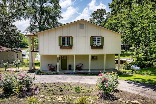 1501 Oak Shore Dr, Tool, TX 75143 - back of house with a porch, fence, and brick siding