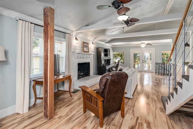 1501 Oak Shore Dr, Tool, TX 75143 - living room featuring vaulted ceiling with beams, stairs, a fireplace, light wood-type flooring, and a ceiling fan