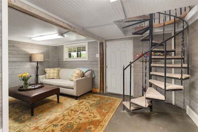 1501 Oak Shore Dr, Tool, TX 75143 - living room featuring wood walls, concrete flooring, and stairway