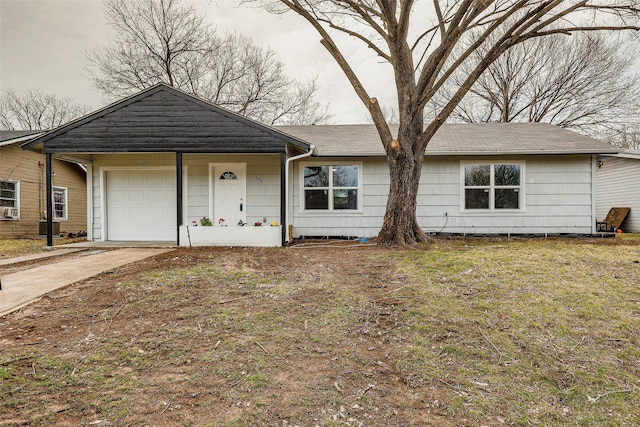 ranch-style house with concrete driveway and an attached garage