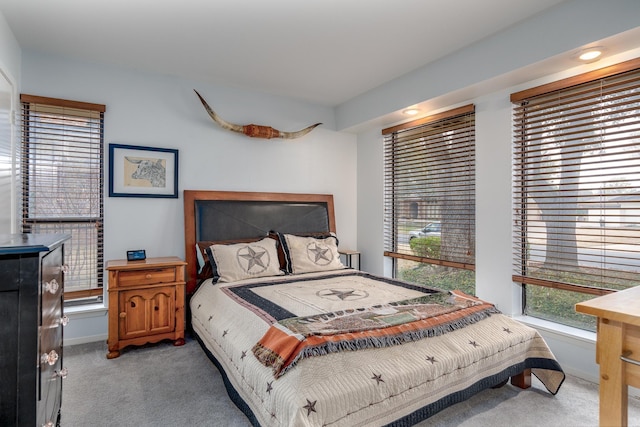 bedroom featuring carpet floors and baseboards