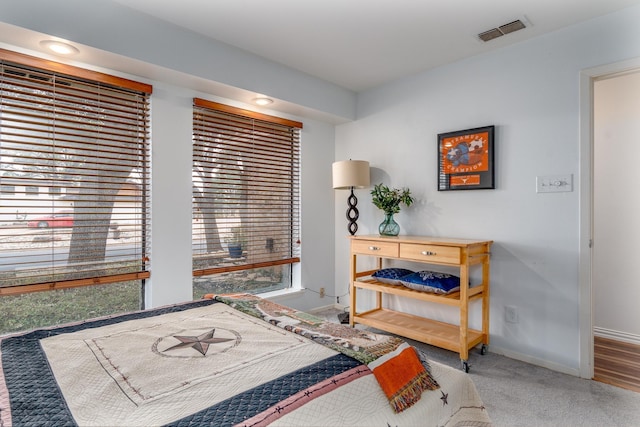 bedroom with visible vents and baseboards