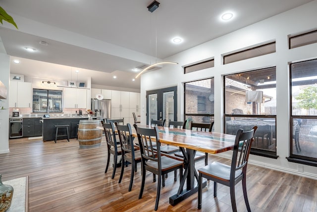 dining room featuring recessed lighting and wood finished floors