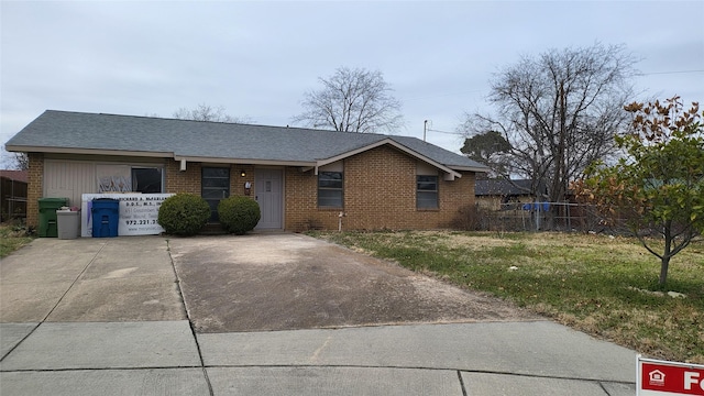 single story home with brick siding, a front lawn, a shingled roof, and fence