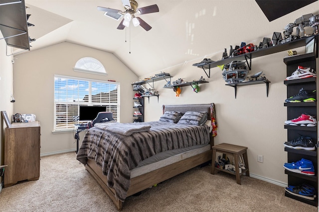 bedroom featuring lofted ceiling, baseboards, a ceiling fan, and light colored carpet