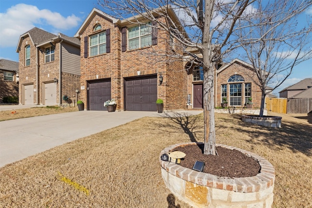 view of front of house with concrete driveway, brick siding, an attached garage, and a front yard