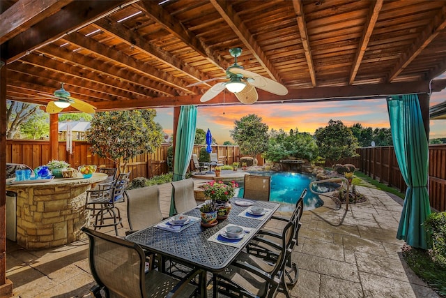 view of patio / terrace with outdoor dining space, a fenced backyard, and ceiling fan