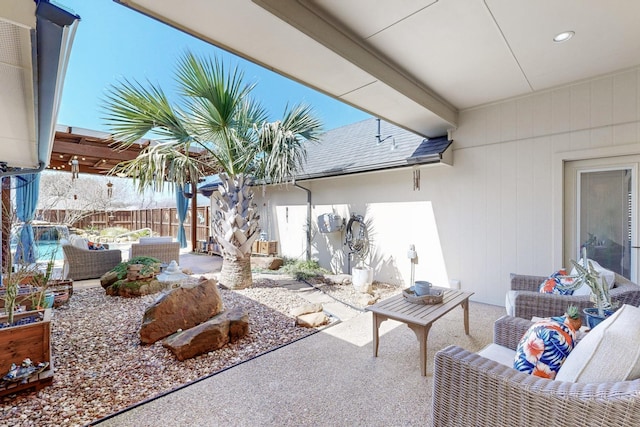 view of patio / terrace with outdoor lounge area and fence