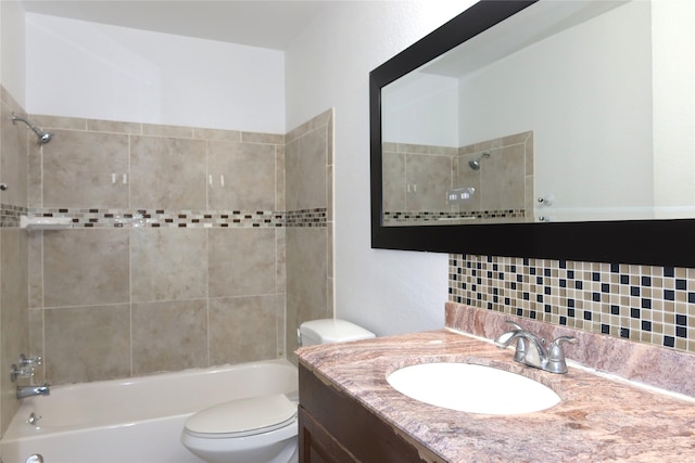 bathroom with decorative backsplash, tub / shower combination, vanity, and toilet