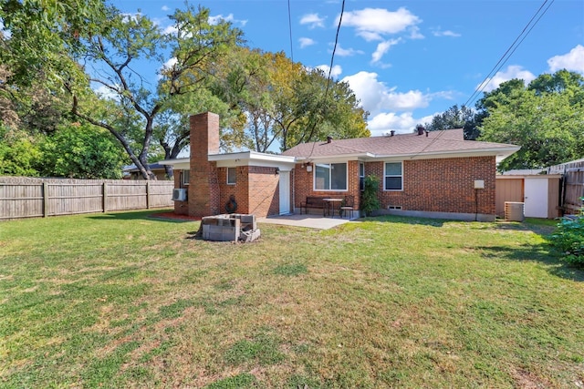 back of property featuring a patio area, a chimney, fence, and brick siding