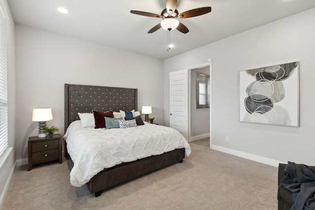 bedroom with light carpet, ceiling fan, baseboards, and recessed lighting