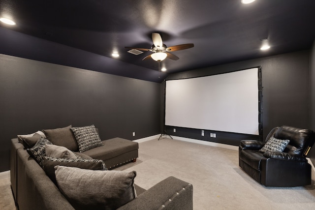 cinema featuring lofted ceiling, ceiling fan, light carpet, visible vents, and baseboards