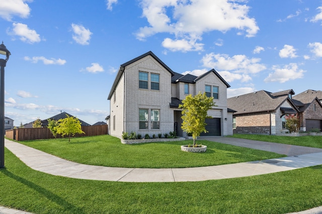 traditional-style home with a garage, brick siding, fence, driveway, and a front lawn