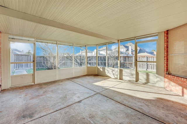 unfurnished sunroom featuring a residential view