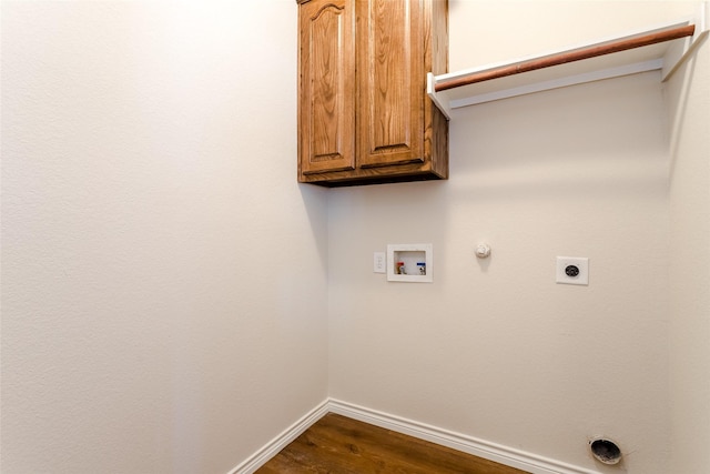 washroom featuring hookup for a gas dryer, washer hookup, baseboards, cabinet space, and electric dryer hookup