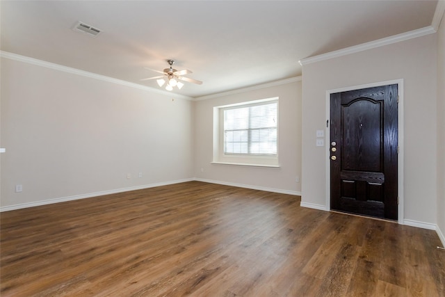 entryway with ornamental molding, dark wood-style flooring, visible vents, and baseboards