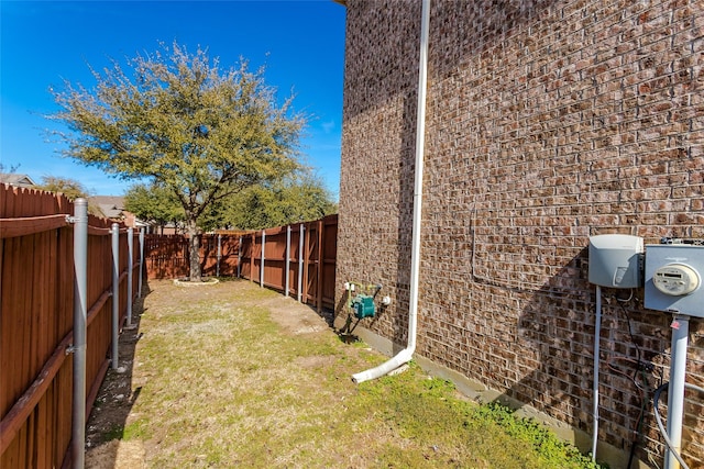 view of yard with a fenced backyard